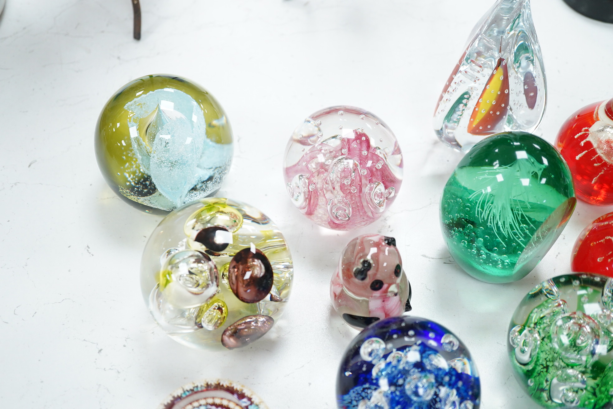 A group of glass paperweights to include Caithness and Perthshire, largest 14cm high. Condition - good